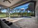 Relaxing screened-in pool area with tiled patio and comfortable lounge seating at 2106 Ridgewind Way, Windermere, FL 34786