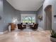 Sitting area with neutral color palette, tile flooring, and natural light at 2106 Ridgewind Way, Windermere, FL 34786