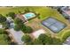 Aerial view of community pool, tennis court, and lush landscaping at 2363 Lancashire St, Davenport, FL 33896