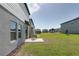 Spacious backyard with a concrete patio and green lawn perfect for outdoor enjoyment at 2363 Lancashire St, Davenport, FL 33896