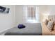 This bedroom includes TV mounted on wall, queen bed and natural light at 2363 Lancashire St, Davenport, FL 33896