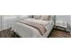 Charming bedroom with wood floors, comfy bed, and natural light at 2363 Lancashire St, Davenport, FL 33896