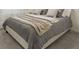 Comfortable bedroom showcasing a bed with gray bedding and patterned pillows at 2363 Lancashire St, Davenport, FL 33896