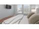 Cozy bedroom features a comfortable bed, soft lighting, and bright windows at 2363 Lancashire St, Davenport, FL 33896