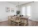 Dining room with natural light, wood table, and seating for six at 2363 Lancashire St, Davenport, FL 33896