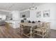 Stylish dining room with wood table and chairs beneath a modern chandelier at 2363 Lancashire St, Davenport, FL 33896