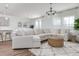 Cozy living room with modern furniture, pendant lighting, and wood flooring at 2363 Lancashire St, Davenport, FL 33896