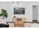 Spacious living room with a large TV, modern furniture, and stylish decor at 2363 Lancashire St, Davenport, FL 33896