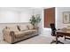 Comfortable office space featuring a couch, desk, chair, and decor accents at 2363 Lancashire St, Davenport, FL 33896