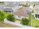 Aerial view of the backyard of a house with solar panels on the roof at 245 Bella Verano Way, Davenport, FL 33897