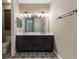 Bathroom featuring a double vanity, stylish tile floors, and modern fixtures at 245 Bella Verano Way, Davenport, FL 33897