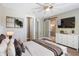 Inviting main bedroom features a modern ensuite bathroom, a walk-in closet, and ample natural light at 245 Bella Verano Way, Davenport, FL 33897