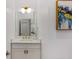 Bathroom vanity area with gold hardware and abstract painting at 2607 Lafayette Ave, Winter Park, FL 32789