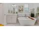Elegant bathroom featuring a standalone tub, marble accents, and a bright, airy ambiance at 2607 Lafayette Ave, Winter Park, FL 32789