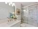 Bathroom features a shower and bathtub combo with white marble at 2607 Lafayette Ave, Winter Park, FL 32789