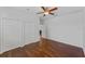 An empty bedroom with wood floors and a double closet at 2607 Lafayette Ave, Winter Park, FL 32789