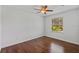 Bedroom features wood floors, a ceiling fan, and a window at 2607 Lafayette Ave, Winter Park, FL 32789