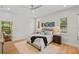 Bright bedroom with hardwood floors and two windows at 2607 Lafayette Ave, Winter Park, FL 32789