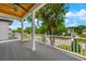 Spacious deck with white railings, offering a peaceful view of the surrounding neighborhood at 2607 Lafayette Ave, Winter Park, FL 32789