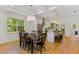 Elegant dining room with modern lighting, hardwood floors, and open to kitchen at 2607 Lafayette Ave, Winter Park, FL 32789