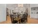 Dining room features hardwood floors, stylish decor, and adjacent staircase at 2607 Lafayette Ave, Winter Park, FL 32789