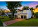 Stunning two-story home with a well-manicured lawn, covered front porch, and two-car garage at 2607 Lafayette Ave, Winter Park, FL 32789