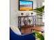 Console table with decorative vases and plants, creating a stylish entryway at 2607 Lafayette Ave, Winter Park, FL 32789