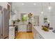 Bright kitchen with stainless appliances, white cabinets and quartz countertops at 2607 Lafayette Ave, Winter Park, FL 32789