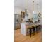 Modern kitchen with stainless steel appliances, island, and pendant lighting at 2607 Lafayette Ave, Winter Park, FL 32789