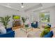 Bright living room features hardwood floors, contemporary decor and a large window with natural light at 2607 Lafayette Ave, Winter Park, FL 32789