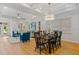 Sun-drenched living space with hardwood floors, open layout to dining room at 2607 Lafayette Ave, Winter Park, FL 32789