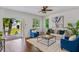 Bright living room with a cozy rug, stylish seating, and an inviting outdoor view at 2607 Lafayette Ave, Winter Park, FL 32789