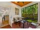 Relaxing outdoor patio with brick flooring, view of backyard, and open access to kitchen at 2607 Lafayette Ave, Winter Park, FL 32789