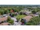 Aerial view of the community featuring mature landscaping, manicured lawns, and tennis courts at 2636 Crown Ct, Kissimmee, FL 34741
