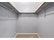 Empty closet showing the basic layout and hanging rails at 2636 Crown Ct, Kissimmee, FL 34741