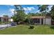 Wide angle of building featuring parking, mature landscaping and lawn at 2636 Crown Ct, Kissimmee, FL 34741
