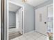 Well-lit foyer with tiled flooring and an open doorway into a spacious living area at 2636 Crown Ct, Kissimmee, FL 34741