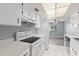 Spacious kitchen with white appliances, ample counter space, and views to the living area at 2636 Crown Ct, Kissimmee, FL 34741