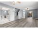 Open-concept living area featuring hardwood floors, stairs, and access to the kitchen at 2636 Crown Ct, Kissimmee, FL 34741