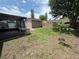 Back yard featuring a storage shed and a screened-in porch at 2842 Blind Owl Dr, Orlando, FL 32822