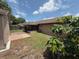 Back yard featuring a storage shed and a screened-in porch at 2842 Blind Owl Dr, Orlando, FL 32822