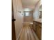 Traditional bathroom featuring a shower/tub, wood floors, and a wood vanity at 2842 Blind Owl Dr, Orlando, FL 32822