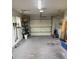 Clean, organized two-car garage showcasing storage shelves and an automatic door opener at 2842 Blind Owl Dr, Orlando, FL 32822