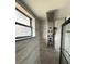 Contemporary shower showcasing a rain shower head and handheld sprayer set against neutral tile at 2842 Blind Owl Dr, Orlando, FL 32822