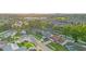 The aerial view reveals well-kept homes in a suburban community with mature trees, a golf course and beautiful greenery at 2871 Milstead St, Orlando, FL 32837