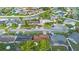 This aerial view showcases homes in a quiet community, with mature landscaping and well-maintained streets at 2871 Milstead St, Orlando, FL 32837