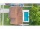 This aerial shot highlights the private backyard pool, lush landscaping and a backyard fence for added privacy at 2871 Milstead St, Orlando, FL 32837