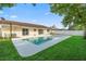 Private backyard featuring a pool, a neutral home exterior, a green lawn, and plenty of sunshine at 2871 Milstead St, Orlando, FL 32837