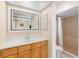 Bathroom with single sink vanity and a shower with decorative accent tiling at 2871 Milstead St, Orlando, FL 32837