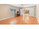 Bedroom showcasing hardwood floors and a view into the adjacent kitchen at 2871 Milstead St, Orlando, FL 32837